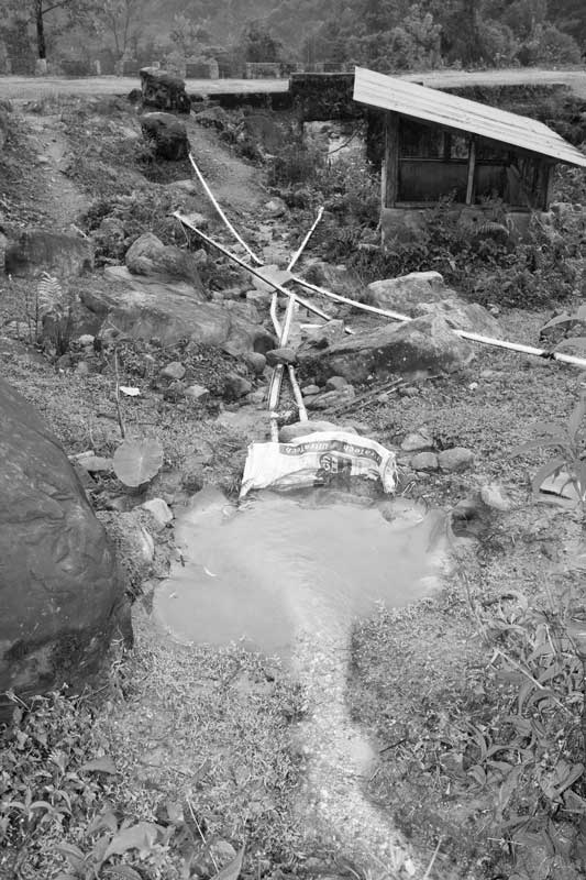 Piping water from an unprotected spring for supply in schools and other urban localities in Garu town, Arunachal Pradesh